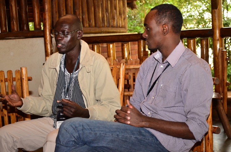 Kwezi Tabaro listens to Vukoni Lupa Lasaga at an Ubuntu Conversation session at the #Writivism2015 festival